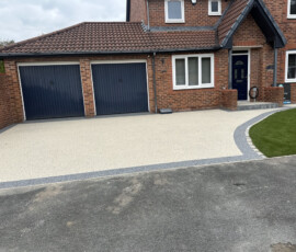 Durable, low-maintenance resin bound driveway providing a puddle-free, SUDS-compliant surfacing solution.